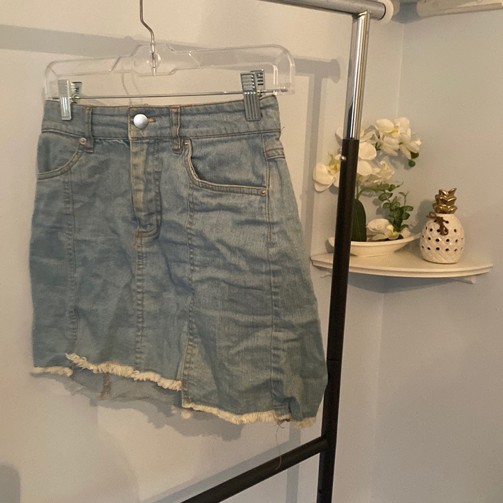 Light denim mini skirt with fringe bottom detail